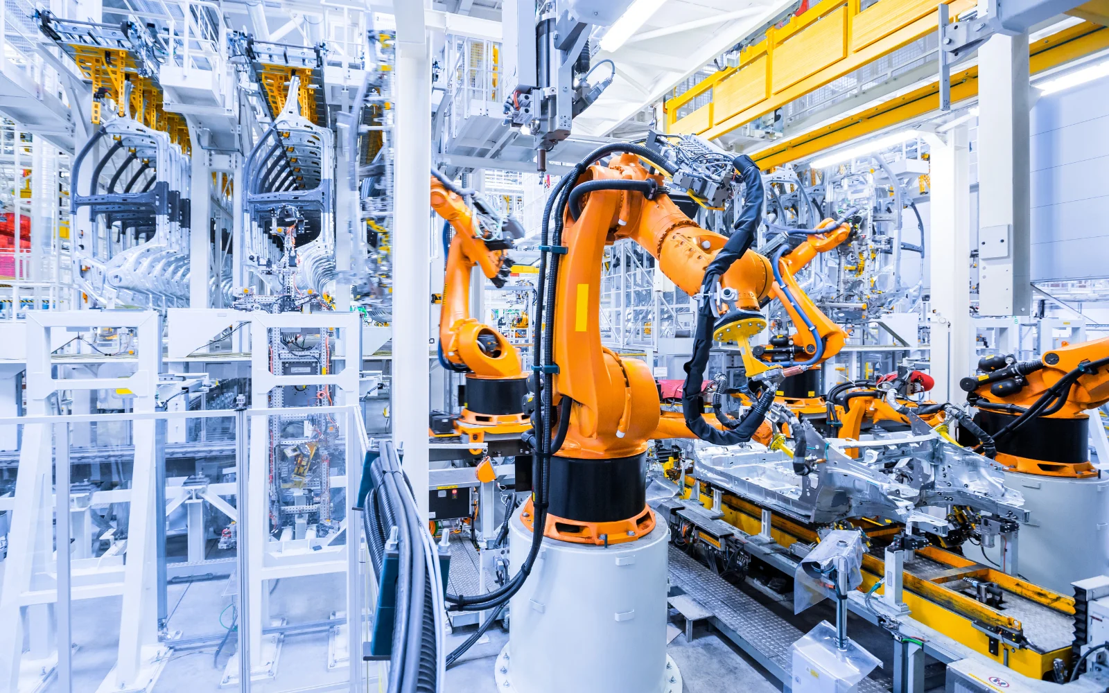 Industrial robotic arms on an automotive production line