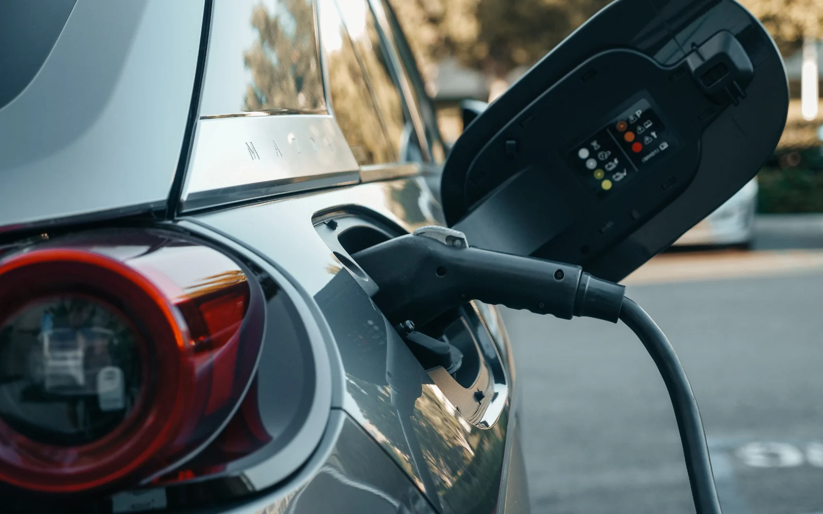 Charging connector plugged into an electric vehicle