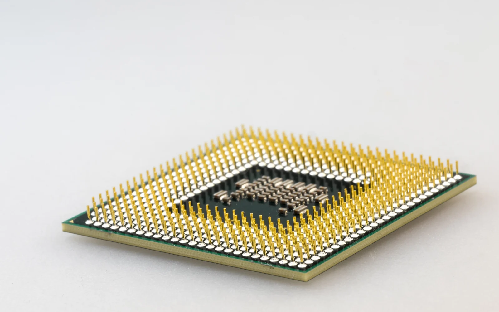 Underside of a microprocessor package with an array of gold contacts