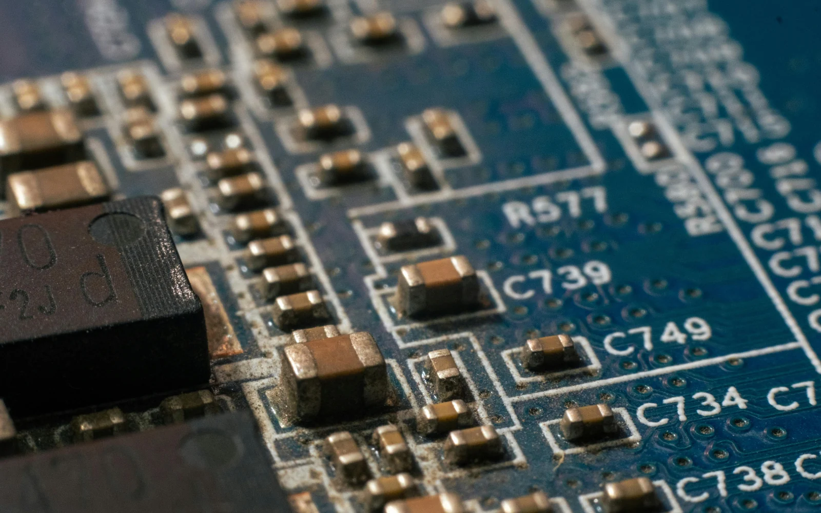 Close view of an integrated circuit package and adjacent board components