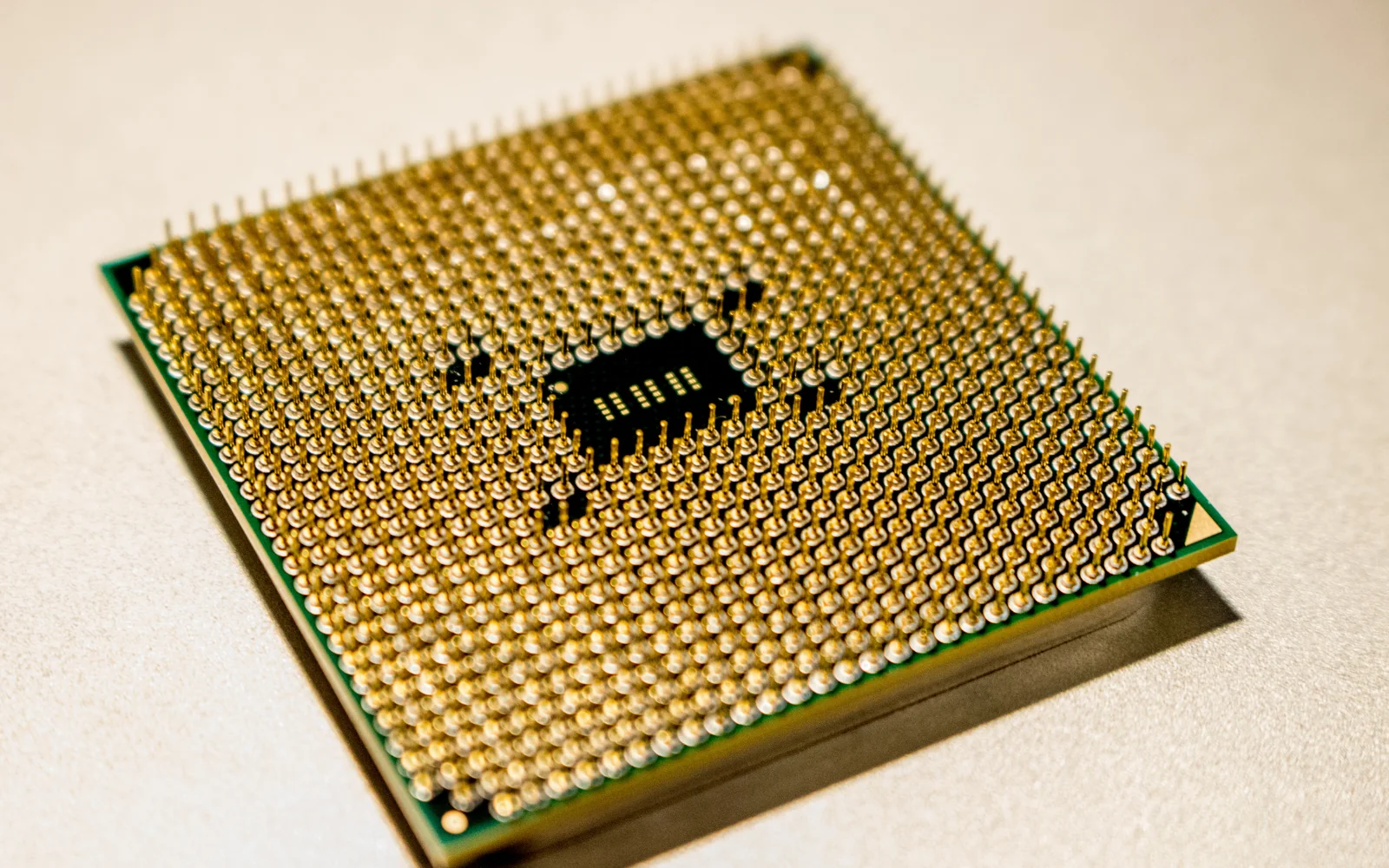 Gold pins on the underside of a processor package