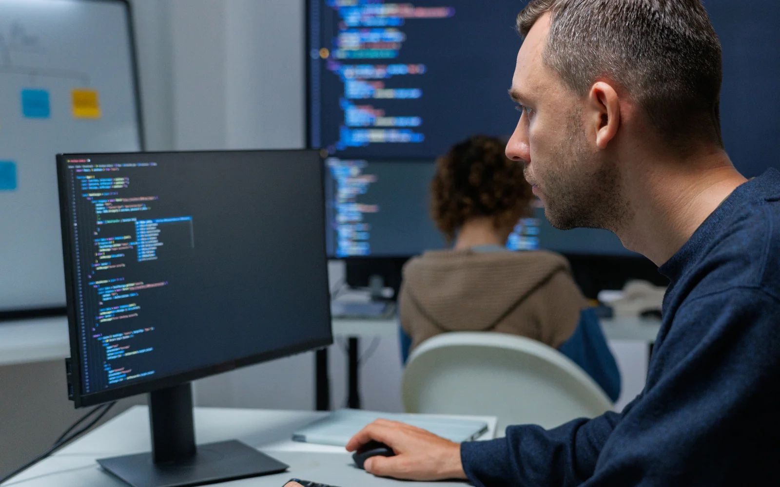 Developer reviewing software at a workstation