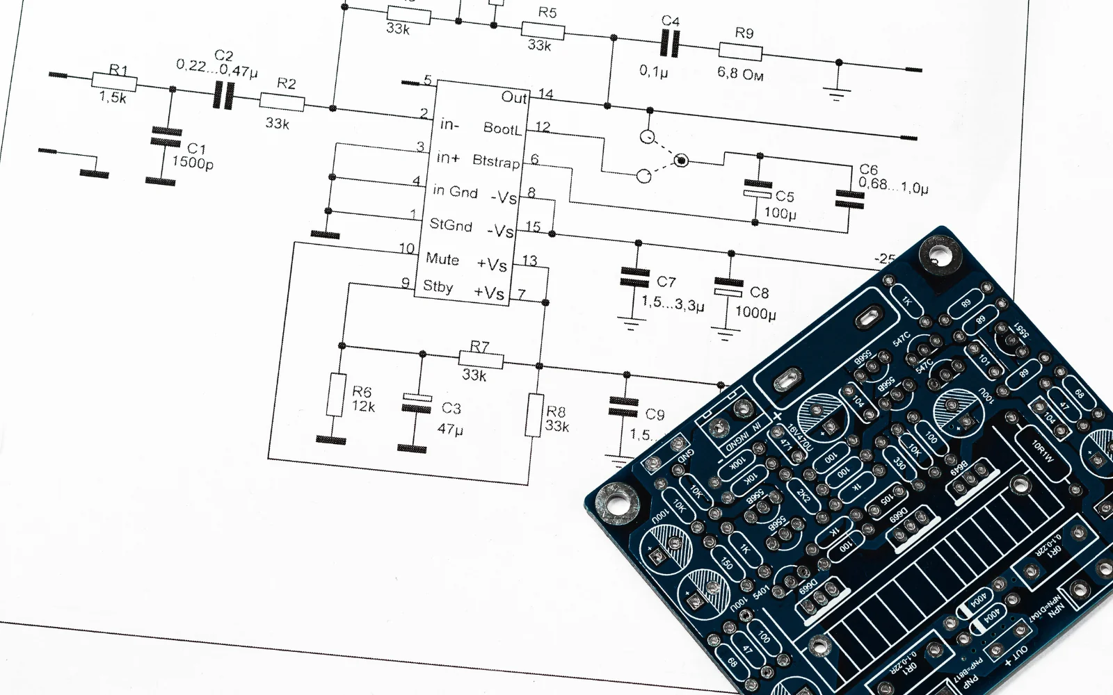 Printed circuit board alongside its circuit schematic