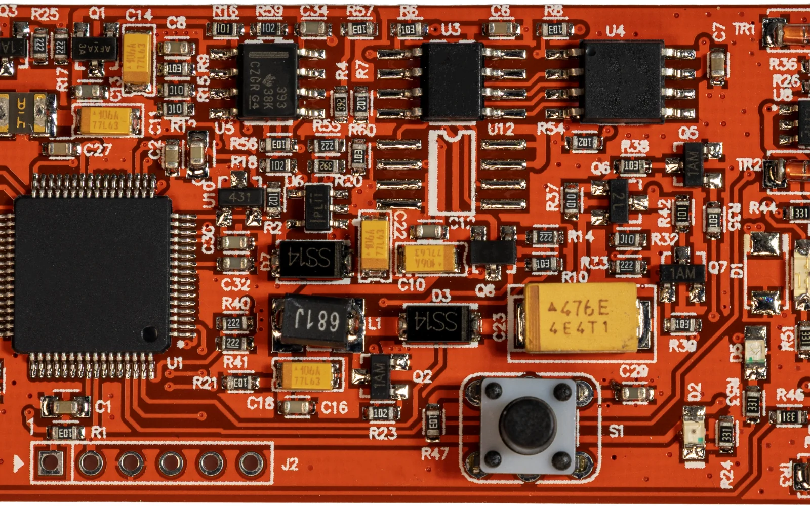 Microcontroller and supporting components on a red development board