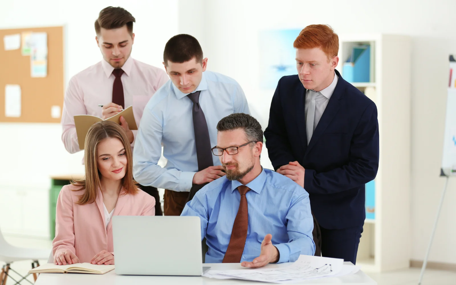 Colleagues reviewing a project around a table