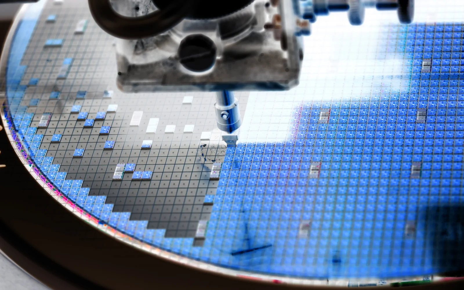 Semiconductor wafer positioned beneath manufacturing equipment